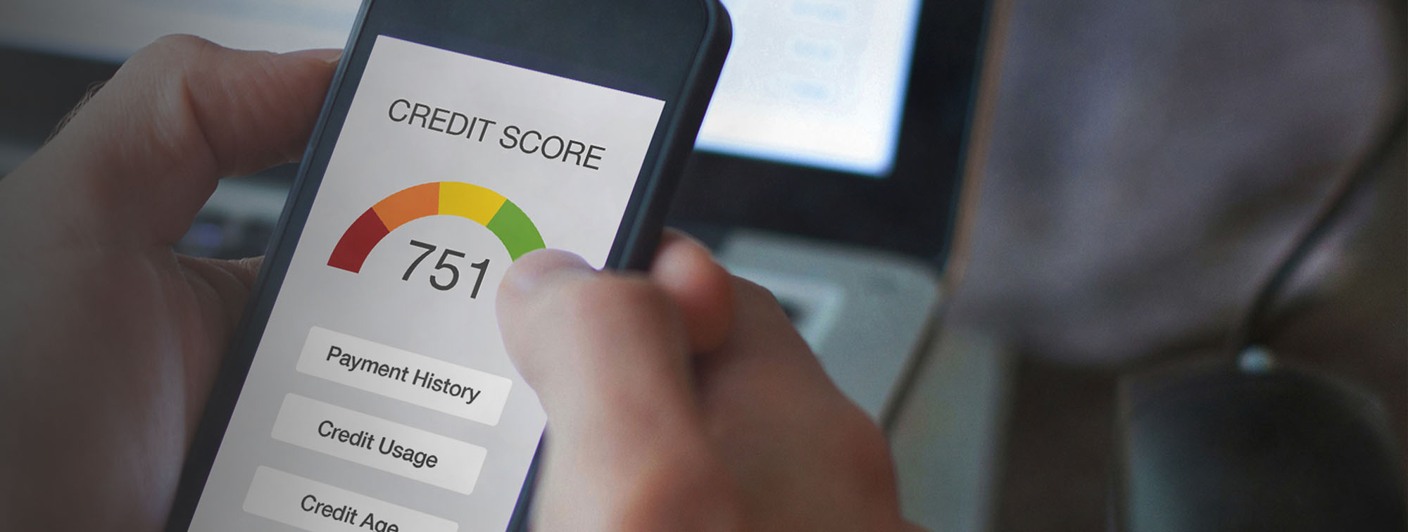 Person looking at their credit score on a mobile device