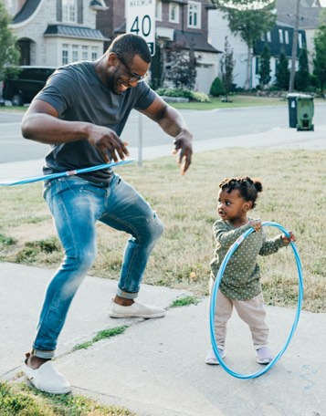 father and daughter hula hooping